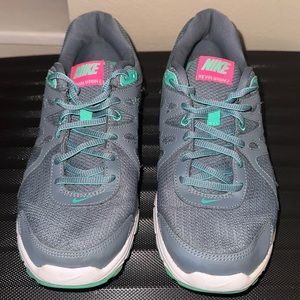 Gently used grey Nike tennis shoes